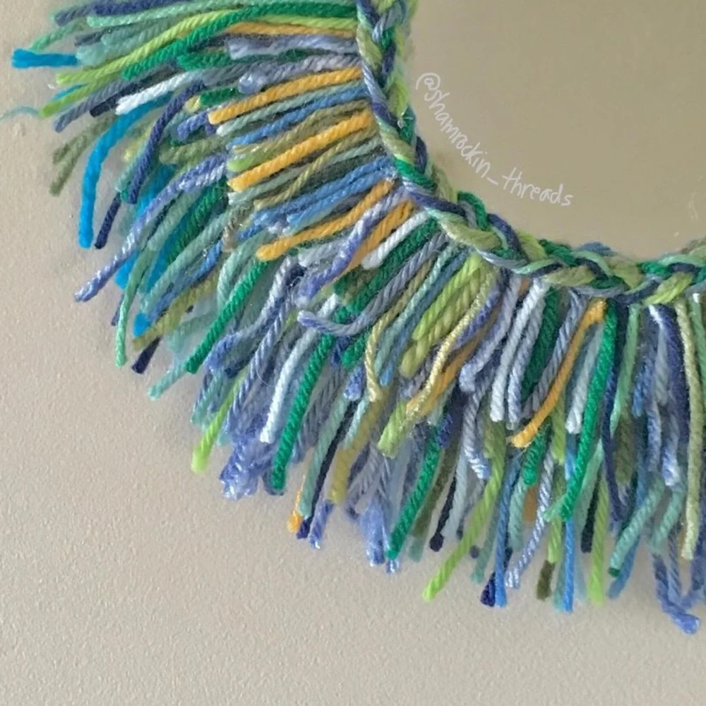 blue green and gold fringe mirror